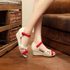 Image of GONGYIBUXIE OPEN TOE FLORAL PATTERN EMBRO CANVAS SANDALS